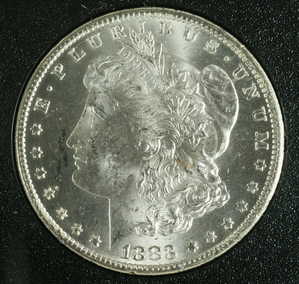 1883 cc Morgan dollar MS60 6.1.plastic case/no ou: 1883 cc Morgan dollar MS60 6.1.plastic case/no outer box