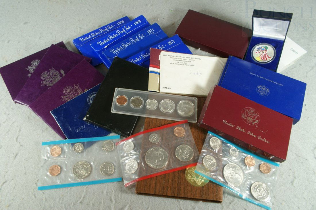 About 17 various mint products including (8) proo: About 17 various mint products including (8) proof sets 1969//1986, Statue of Liberty 2-piece proof set, 1984 Olympics (2) dollar proof set, 1988 Olympic dollar, colorized silver eagle, blue and brown