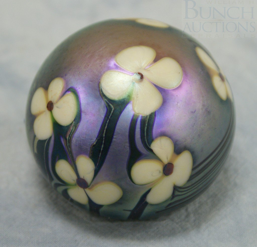 Orient & Flume art glass paperweight, signed and: Orient & Flume art glass paperweight, signed and paper label "444 A 1976", iridescent lavender with green & cream flowers, 3" dia