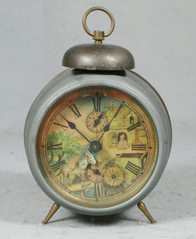 German outside bell alarm clock, paper litho dia: German outside bell alarm clock, paper litho dial with barnyard scene, wagon wheel rotates, strike side not operating, 6" tall