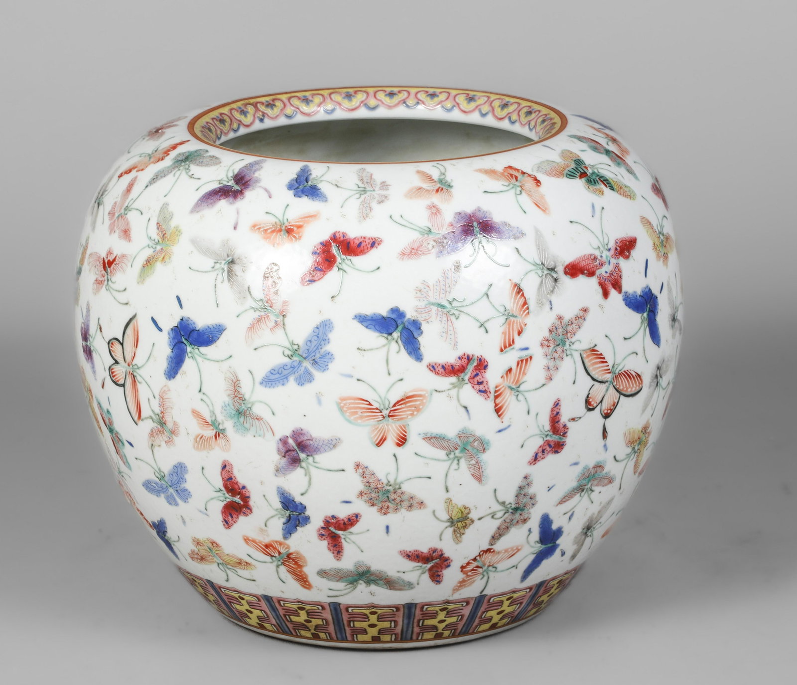 Chinese Famille Rose Jar: Chinese famille rose porcelain jar, butterfly decoration, 6-character mark to base, 7-1/2" h x 8-1/2" dia