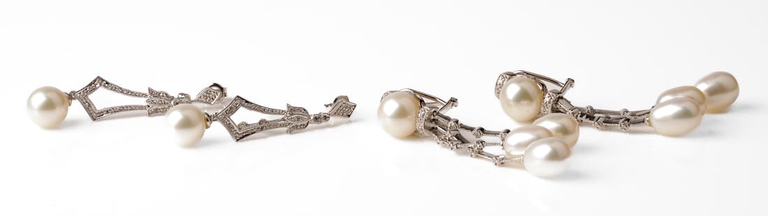 (2) Pairs 14K White Gold Diamond and Pearl Earrings: (2) Pairs 14K White Gold Diamond and Pearl Earrings to include pearl and diamond chandelier earrings, diamond pave spacers, 2 1/4"H, signed C & S 64, 14K, 585, along with a similarly designed pair of 