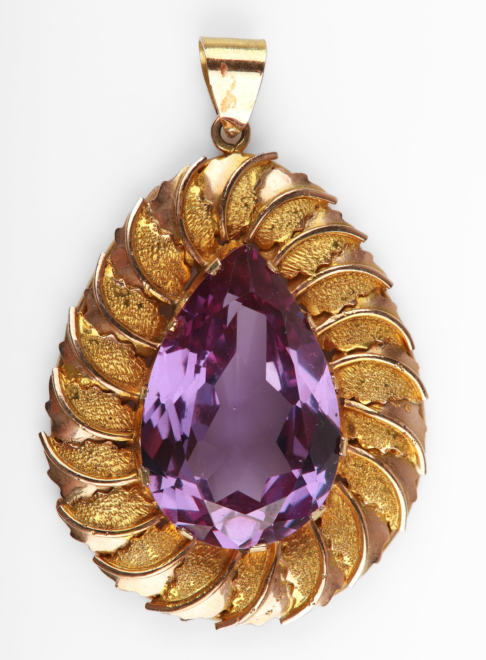 14K Yellow Gold Color Change Sapphire Pendant: 14K Yellow gold color change sapphire pendant, leaf textured gold surround, a pear shaped color change sapphire center, 20 mm x 12 mm H center stone, 10+ CTW, 5.5 DWT