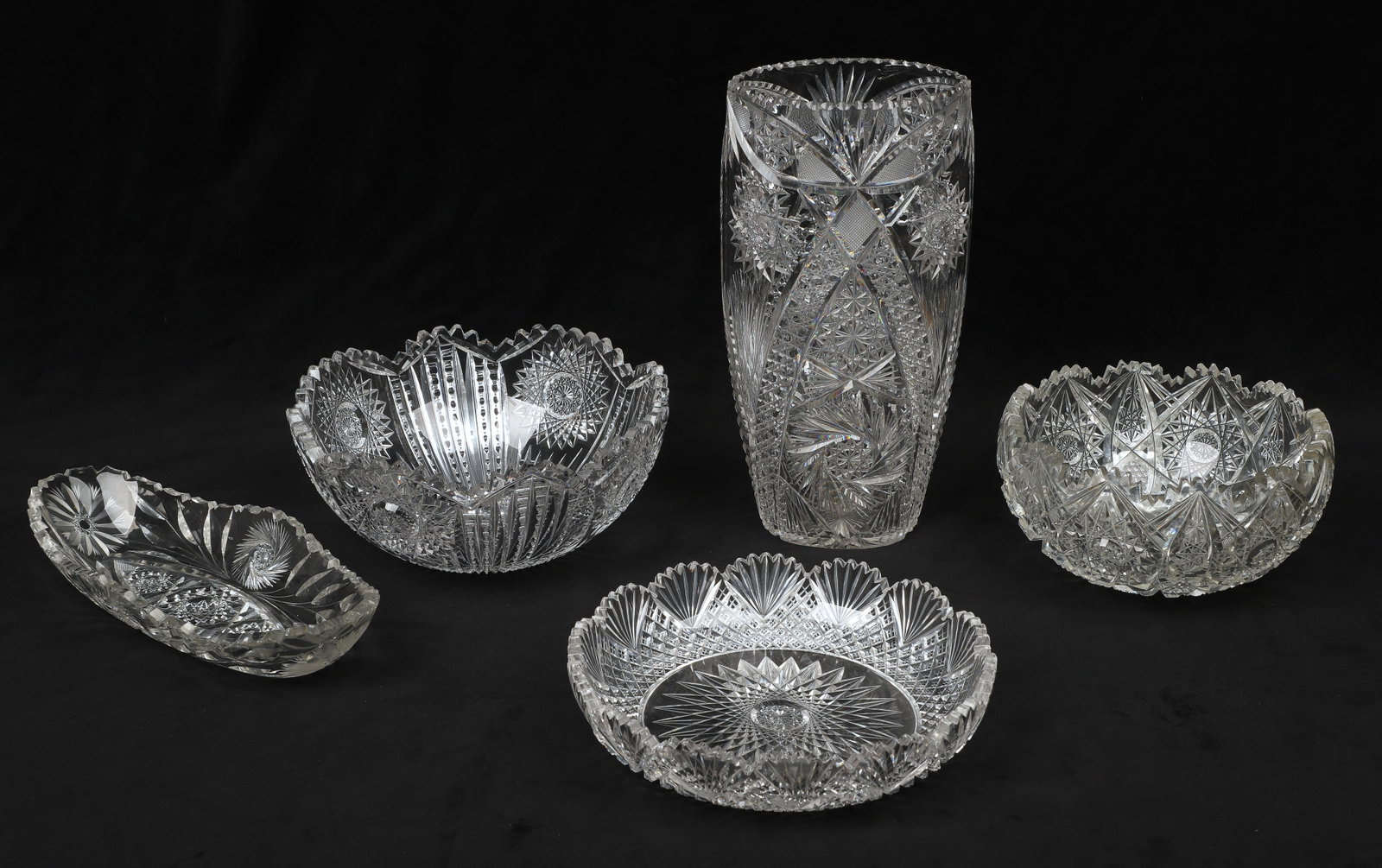 (5) Pcs Cut Glass: (5) Pcs cut glass, c/o vase (11-1/4" h), oval relish dish (11-1/8" x 4-7/8"), (3) bowls (7-1/2" dia x 4" h, 9-1/4" dia x 4" h, 9" dia x 2" h), chips to some teeth