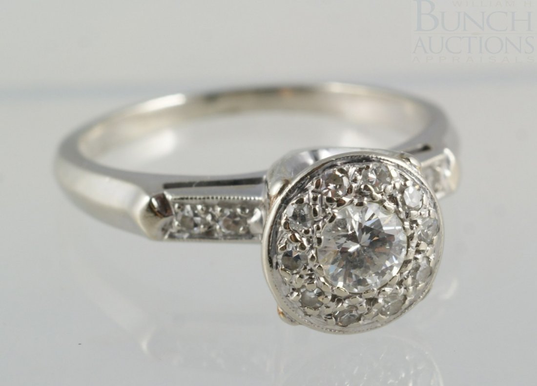 14K WG ladies diamond ring, about 25 pt center st: 14K WG ladies diamond ring, about 25 pt center stone surround by 10 small diamonds, tdw about 1/2 carat, 2.1 dwt, size 6