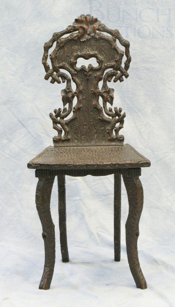 Carved Black Forest Side Chair, originally may h: Carved Black Forest Side Chair, originally may have had a music box under the seat, 34-1/2" tall