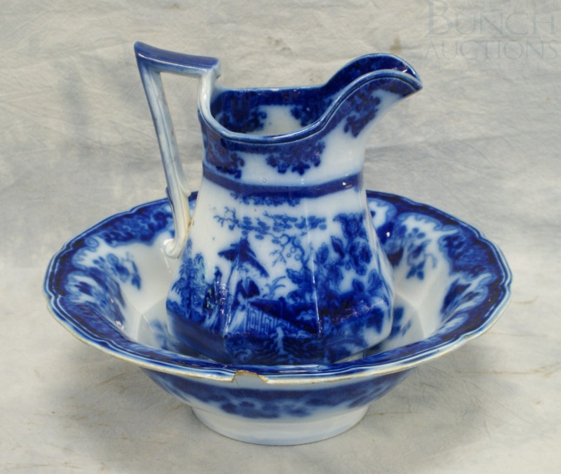 Amoy pattern flow blue pitcher, 10", with a Sobra: Amoy pattern flow blue pitcher, 10", with a Sobraon pattern bowl (damaged)