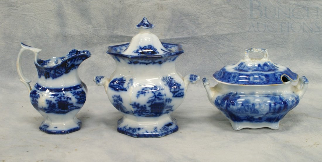 (3) pcs flow blue china, Oriental pattern sauce b: (3) pcs flow blue china, Oriental pattern sauce bowl, with a matching creamer and sugar bowl, 7 3/4" tall, no damage noted