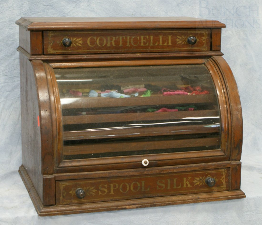 Walnut Glass Cylinder Front Spooled Silk Cabinet: Walnut Glass Cylinder Front Spooled Silk Cabinet with stencil advertising, 21" wide x 18" high x 16" deep