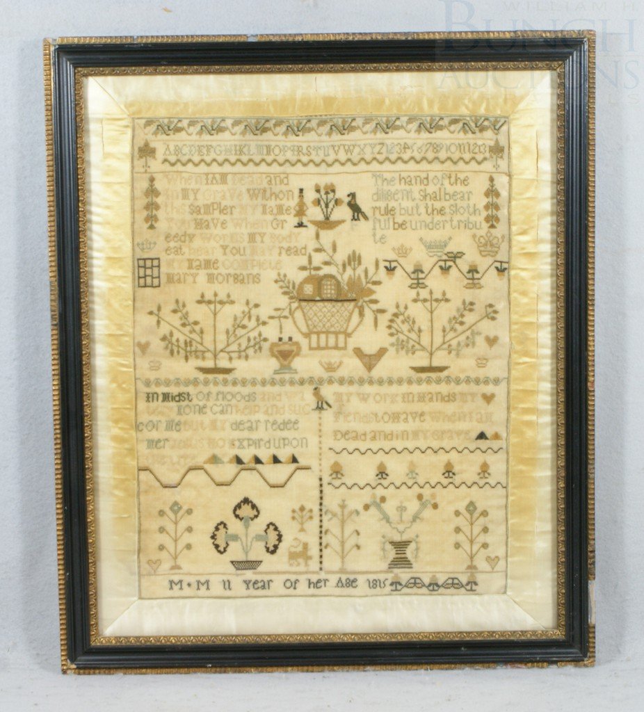 Pictorial needlework sampler, "M*M 11 Year of her: Pictorial needlework sampler, "M*M 11 Year of her age 1815" with crowns, flowers, trees and human figure, original silk border, English, 19" x 16", some discoloration and splits in the silk border