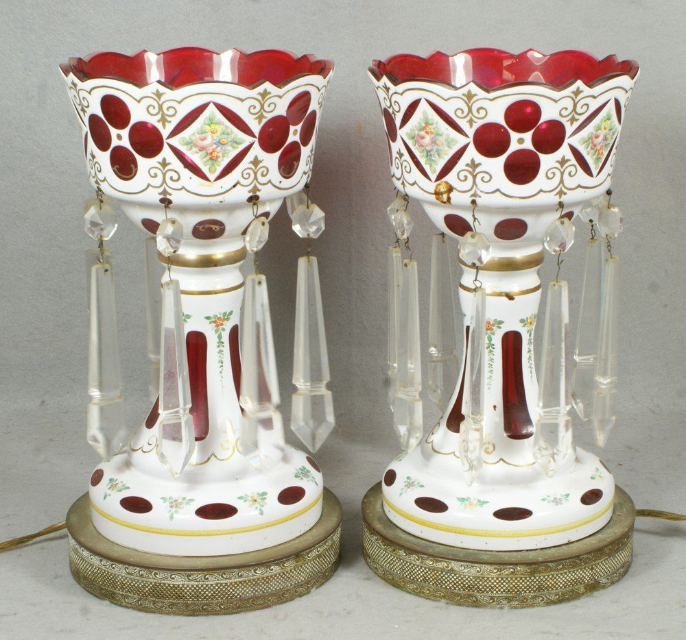 White cut to cranberry cased glass lusters with i: White cut to cranberry cased glass lusters with inverted spear shaped prisms, 1 missing, 13" tall, electrified