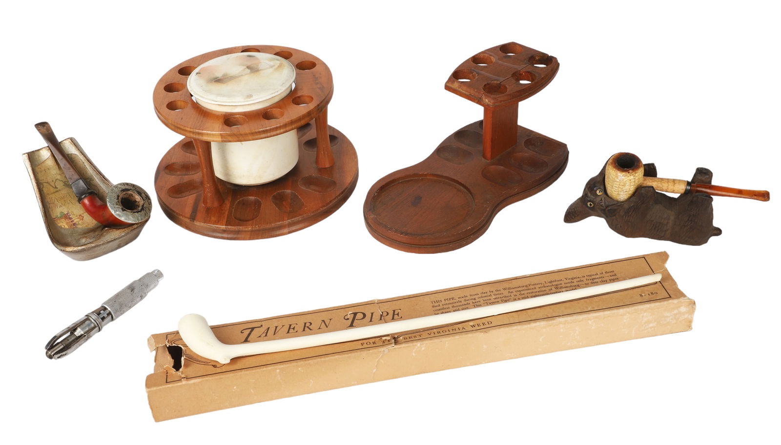 Lot of Tobacco Pipes & Stands: Lot of tobacco pipes and stands, c/o Williamsburg Tavern Pipe with original box, Missouri Meerschaum corncob pipe in carved dog stand, metal double stand with Indian Ocean map, detective style pipe wi