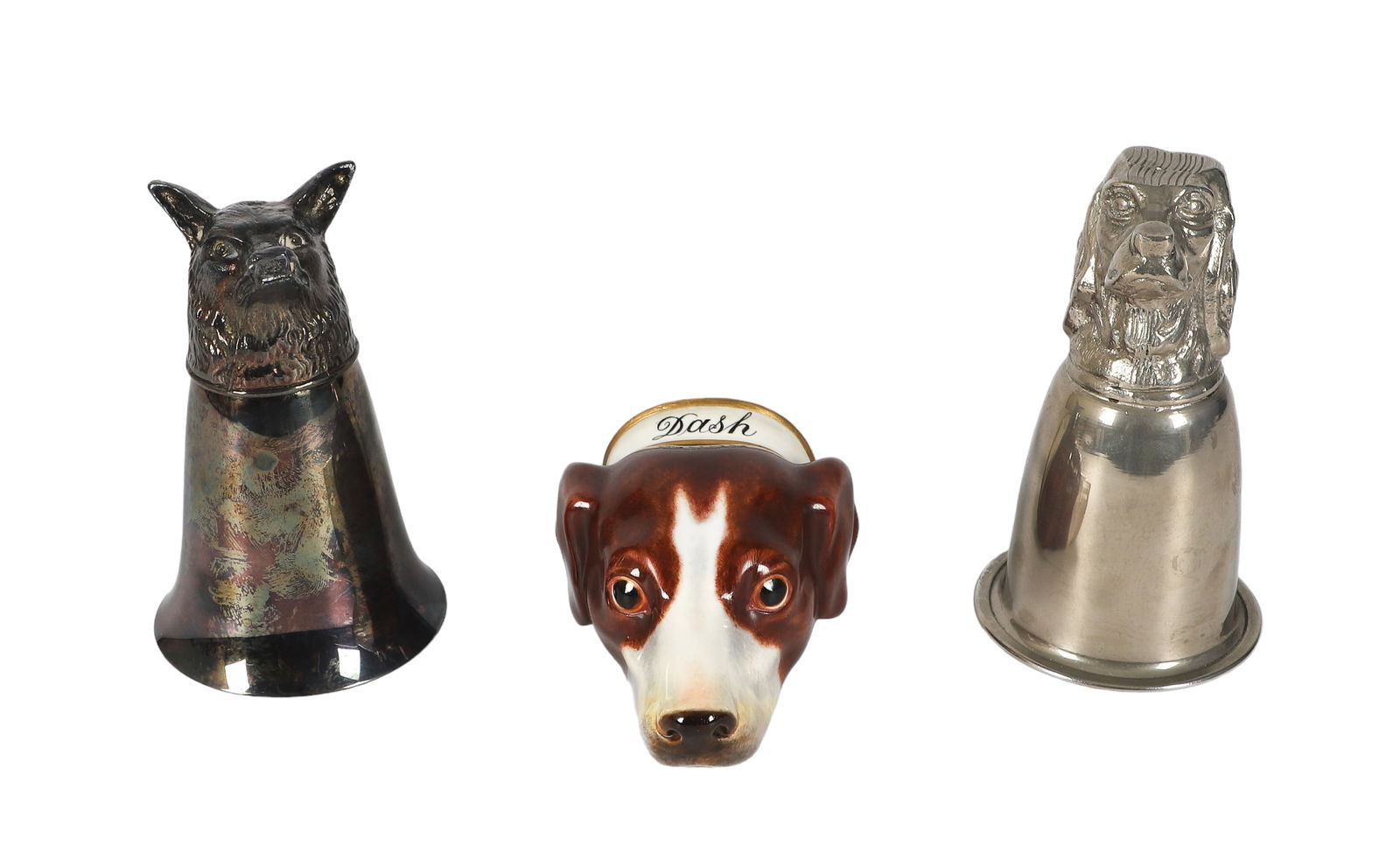 (3) Dog Form Stirrup Cups: (3) Dog form stirrup cups, unmarked, porcelain inscribed "Dash", pewter, silver plate, largest 5-1/2"