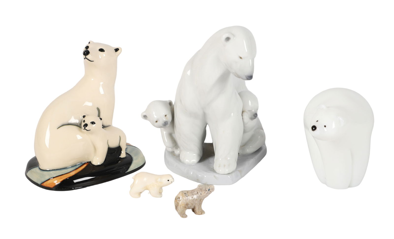 (5) Polar Bear Figures: (5) Polar bear figurines, c/o Lladro porcelain #6745 (6-1/2" h), Moorcroft Pottery 2009 (5-1/8" h), Orient & Flume art glass (3-3/4" h), bone signed "JSP" (2" l x 3/4" h), carved stone (1-5/8" l x 1"
