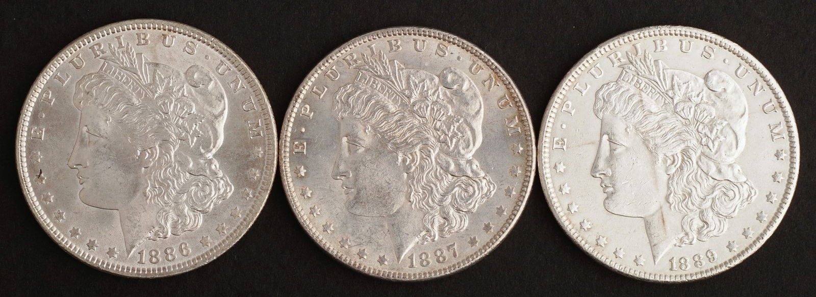 (3) Morgan Silver Dollars, 1886, 1887, 1889, AU (1 of 2)