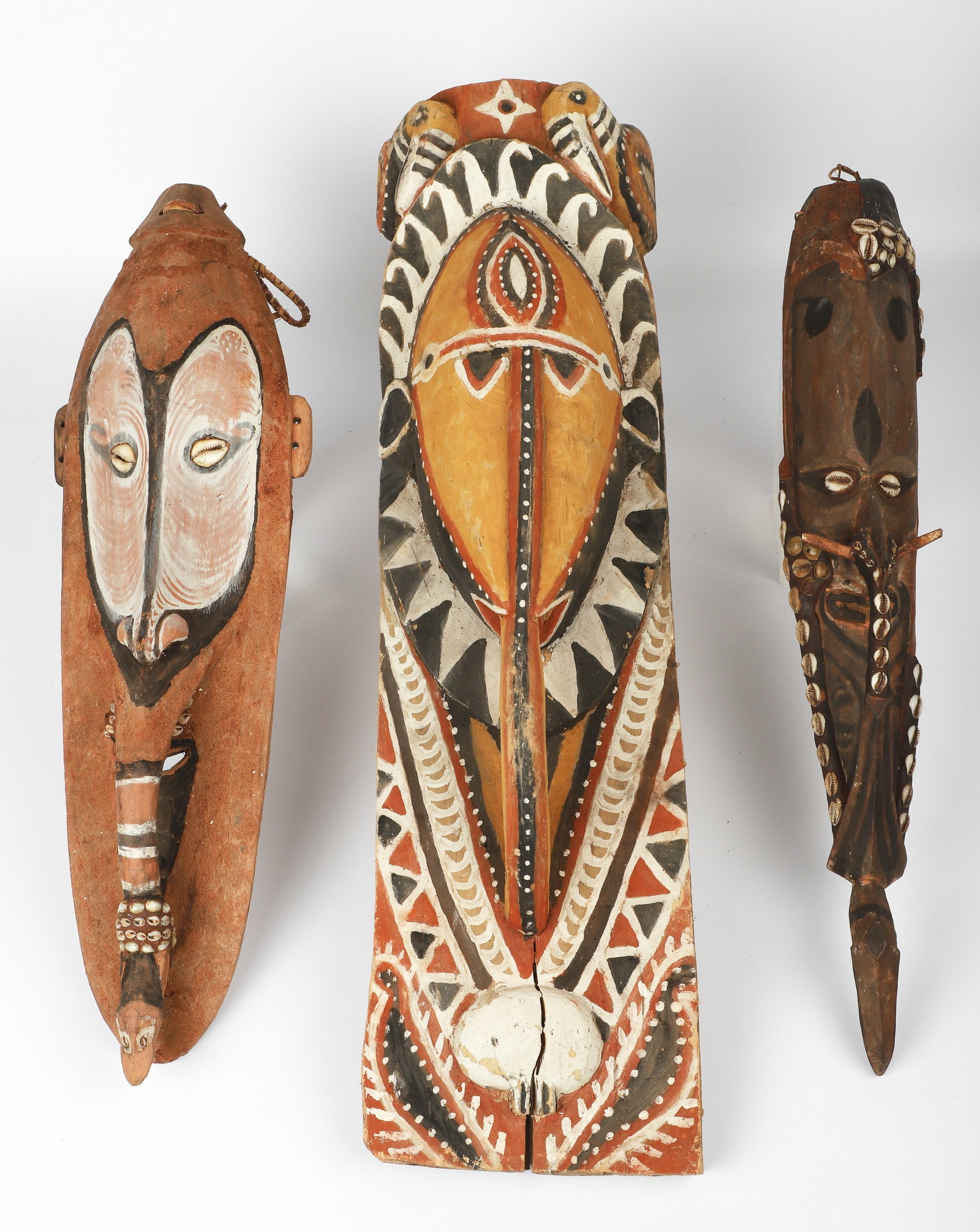 (3) African Tribal Masks: (3) African tribal elongated masks, largest 27" h