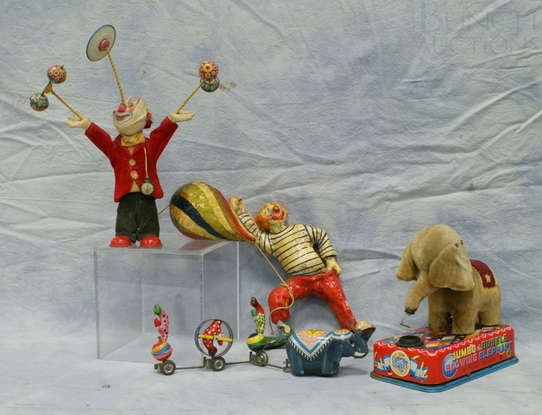 Circus lot, c/o wind-up tin litho & composition j: Circus lot, c/o wind-up tin litho & composition juggling clown, tin litho & plush Jumbo the Bubble Blowing Elephant battery operated toy, tin litho wind-up elephant & clowns train, paper mache clown w