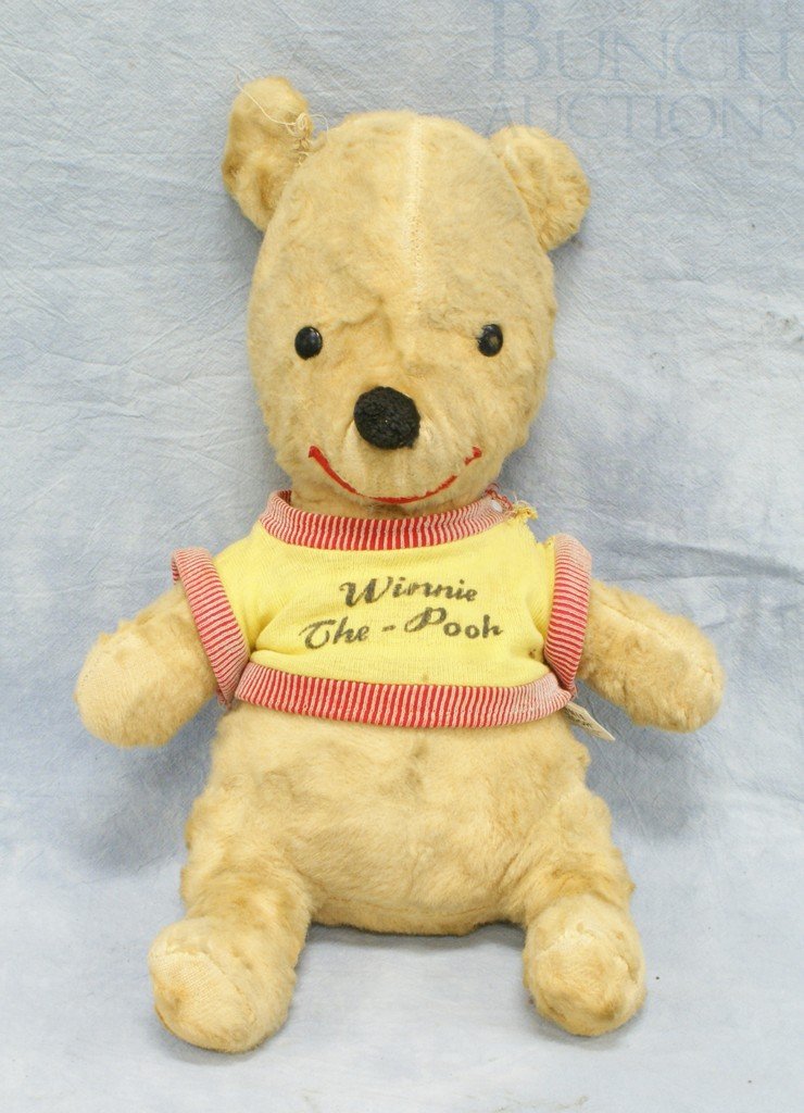 Gund Winnie the Pooh stuffed teddy bear, 13" high: Gund Winnie the Pooh stuffed teddy bear, 13" high, some loose stitching on one ear and on one arm of shirt