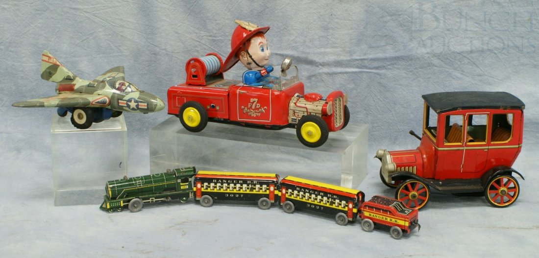 Lot of 4 Tin Litho Transportation Toys, including: Lot of 4 Tin Litho Transportation Toys, including: M Japan USAF plane, TN Japan Fire Engine, TM Japan car (front wheels not attached) and unmarked 4 pc train, tallest 4"