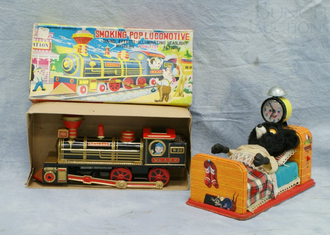 Lot of 2 Tin Litho battery operated toys, to incl: Lot of 2 Tin Litho battery operated toys, to include "Smoking Pop Locomotive" and a Linemar bear in bed, longest 11"