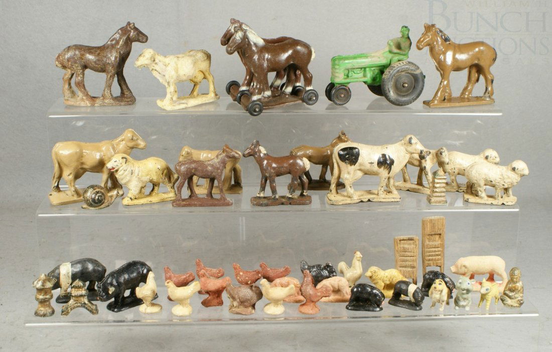 Lot of Auburn Farm animals including one tractor: Lot of Auburn Farm animals including one tractor and double horse on wheels (approx 35 pcs), together with ceramic and plastic miniatures, tallest 3-1/4"