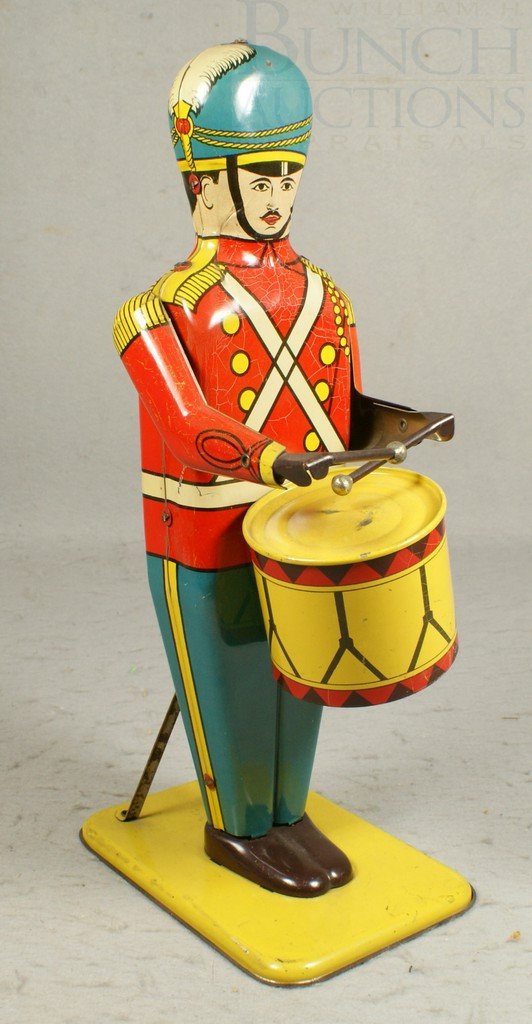 Tin Litho Windup Drum Major no 27 by Wolverine Su: Tin Litho Windup Drum Major no 27 by Wolverine Supply and Mfg Co, in working order, crazing, 13-1/2"