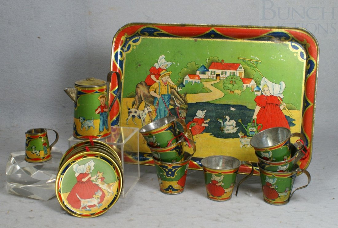 18 pc Amsco Tin Litho tea set including tea pot, : 18 pc Amsco Tin Litho tea set including tea pot, creamer, 7cups, 8 saucers and a tray, tallest 3-1/2"
