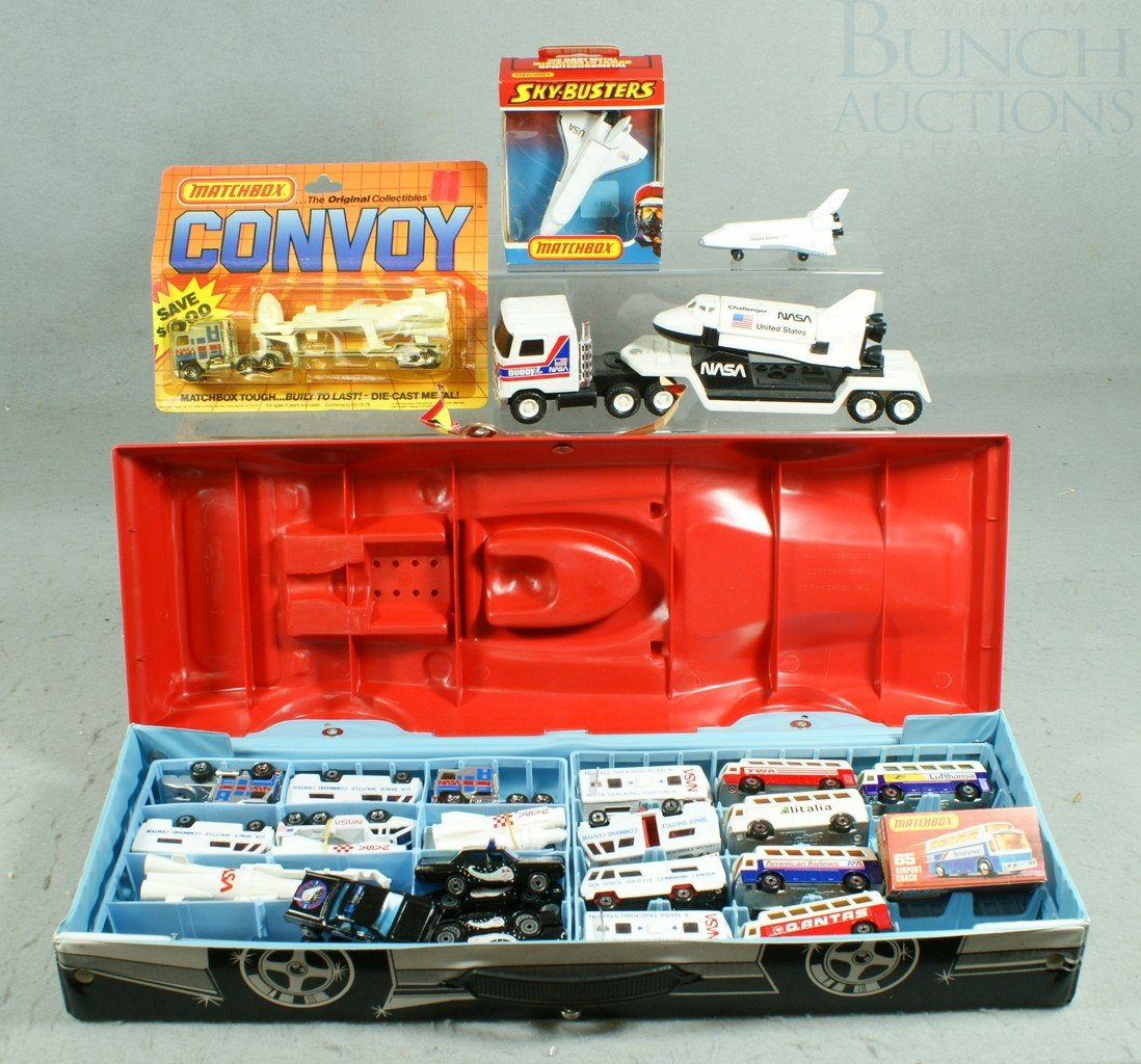 NASA Lot including 14 Matchbox pieces (NASA Conv: NASA Lot including 14 Matchbox pieces (NASA Convoy and SB-3 in original box), 5 Halley's Comet tribute cars, 5 Airport Buses #65 buses (with one box) and a Buddy L NASA Challenger Transporter