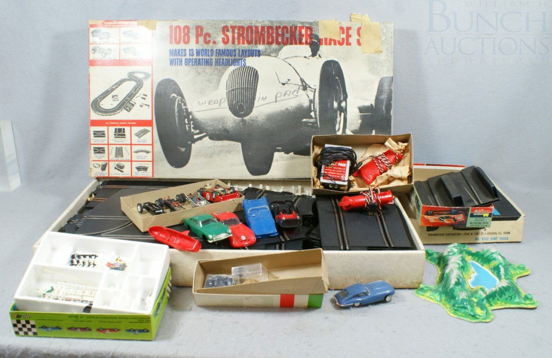 108 pc Strombecker Race Set with 6 car chassis a: 108 pc Strombecker Race Set with 6 car chassis and 4 car bases, together with one ideal car and accessories