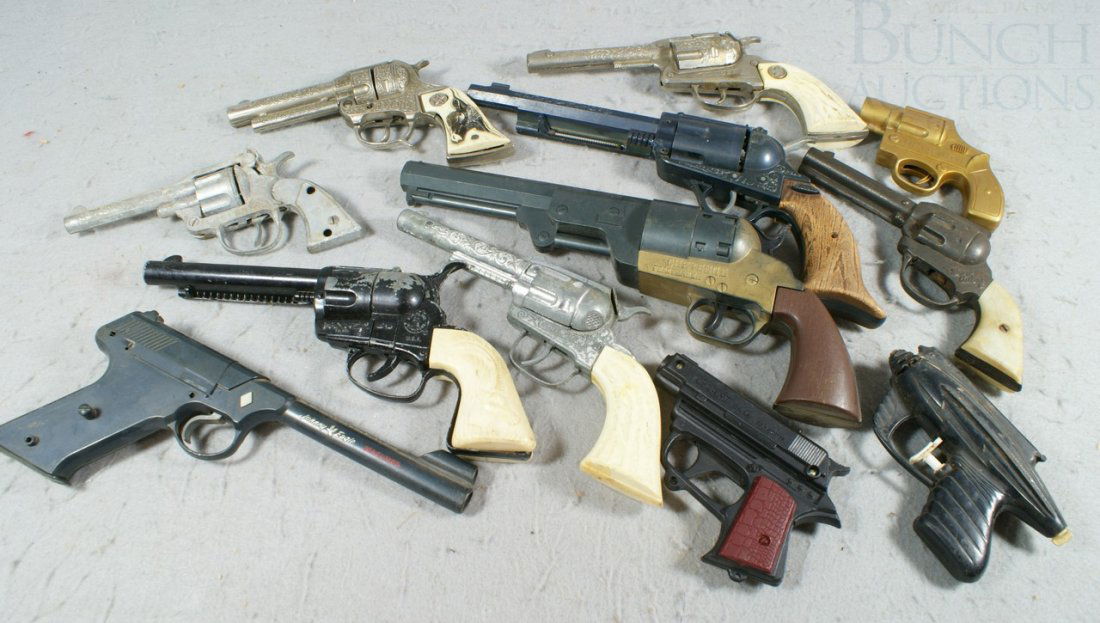 12 Toy Guns including plastic, cast iron and mor: 12 Toy Guns including plastic, cast iron and more, longest 13"