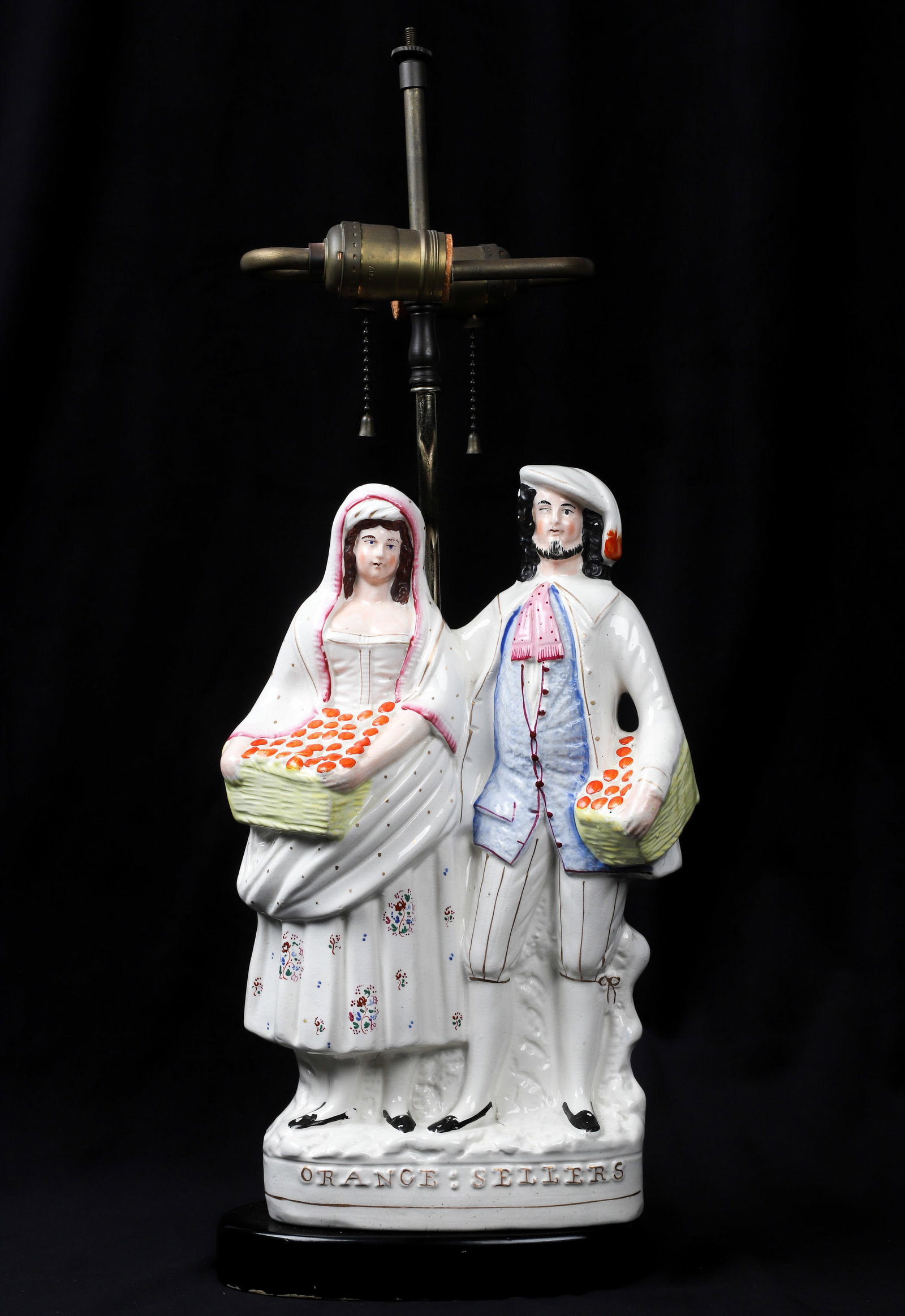 Staffordshire Orange Sellers Figural Table Lamp: Staffordshire "Orange Sellers" porcelain figurine, mounted on wood base as table lamp, figure 14" h