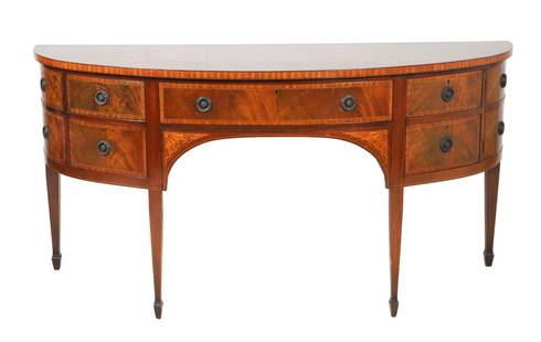 Hepplewhite Style Inlaid Mahogany Bowfront Sideboard, English: English inlaid mahogany bowfront sideboard, center drawer flanked by two doors and 4 faux drawers, fan decoration at lower corners, on tapered legs, adapted from one in the collection of Sir William P