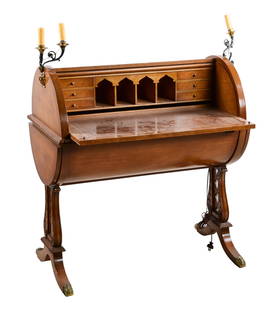 Carved mahogany Regency Style ladies writing desk: Carved mahogany Regency Style ladies writing desk with tambour cylinder closure, pull out writing surface with tooled leather insert, fitted interior with 6 drawers and 4 cubby holes, all raised on ly