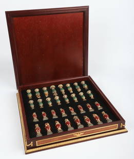 Faberge Imperial Jeweled Chess Set: Imperial Jeweled Chess Set from the House of Faberge by Franklin Mint, 1990, c/o (16) playing pieces of malachite green with 24K gold accents, (16) playing pieces of carnelian red with 24 K gold accen
