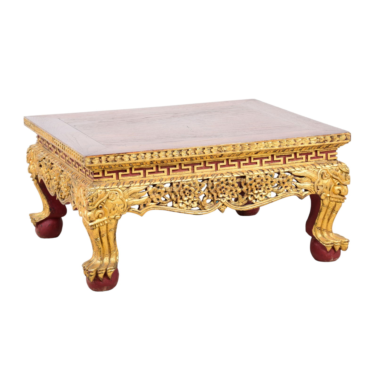 Chinese carved and gilt painted pedestal: Chinese carved and gilt painted pedestal, pierced carved flowers and decoration on skirt, on paw feet, elmwood top with gilt painted base, 12"h x 22"w x 20"d