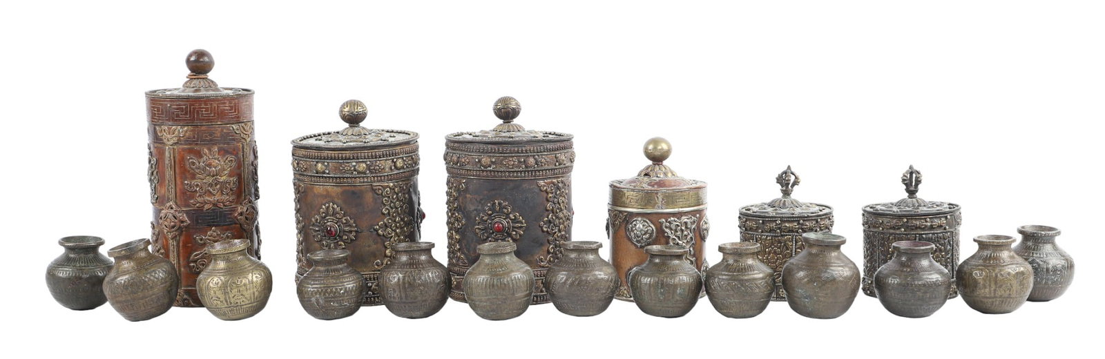 (6) Tibetan Incense Canisters and Jars: (6) Tibetan Incense canisters and jars to include (1) 9"H mixed metal canister with similarly designed 5 3/4" H jar, a pair of mixed metal red glass mounted jars, 7"H each, a pair of repousse mixed me