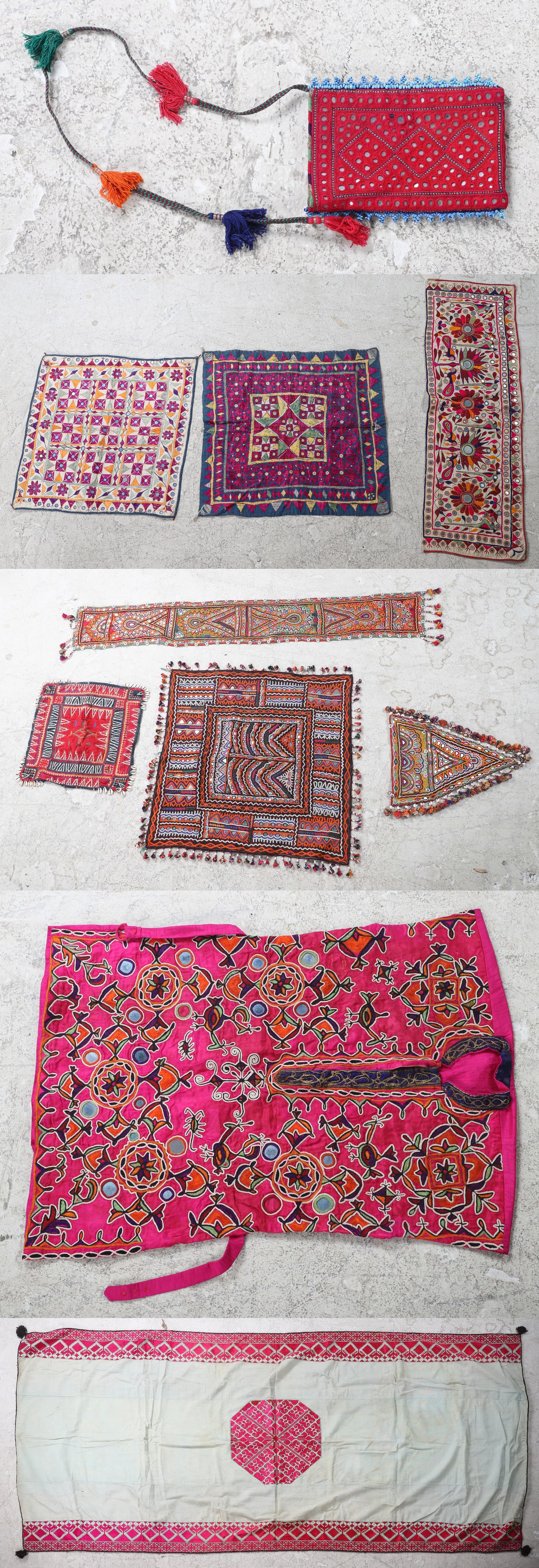 Banjara Fabrics and Vest: Banjara fabrics and vest, vest with 40" bust, (3) assorted cowrie shell and bead trimmed portions, rectangular piece in bird decoration, a similarly designed assembled pair of square embroideries and 