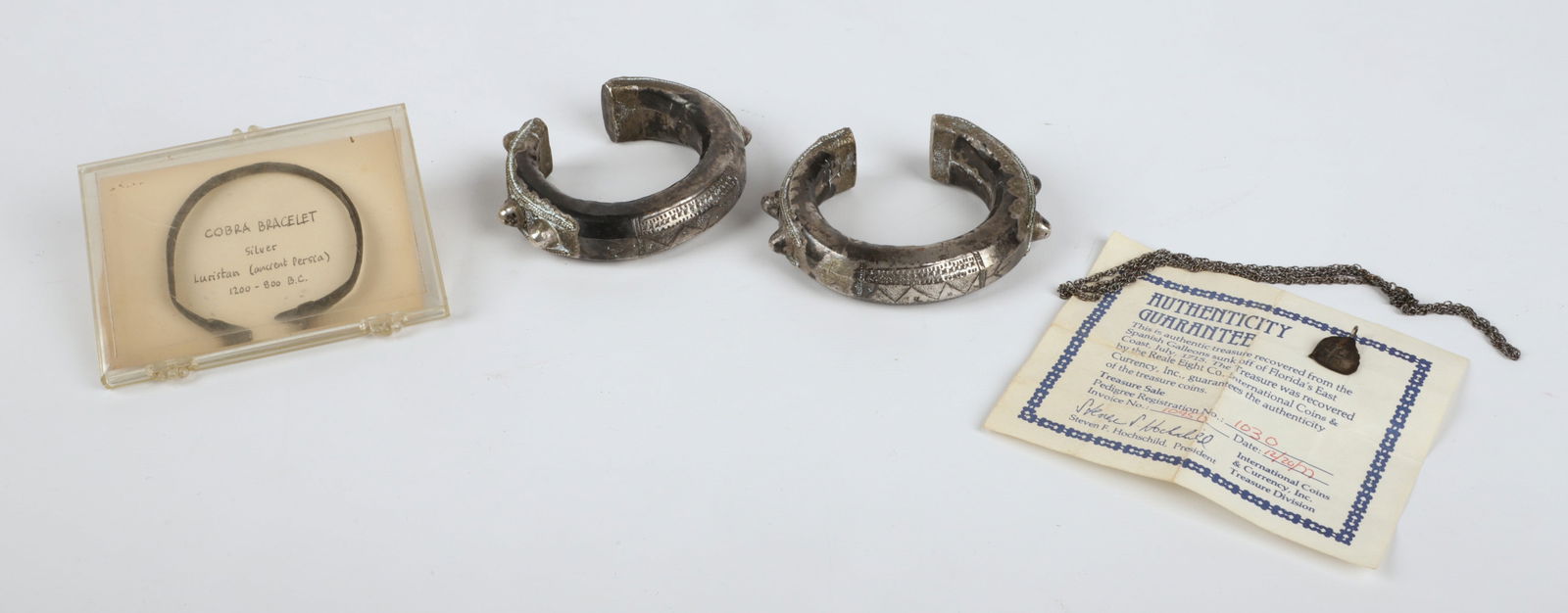 (4) Pcs Antique Silver Jewelry: (4) Pcs antique silver jewelry, c/o cobra bracelet from Luristan (ancient Persia) c 1200-800 BC, (2) cuff bracelets, coin shard mounted as pendant recovered from the Spanish Galleons sunk off of Flori