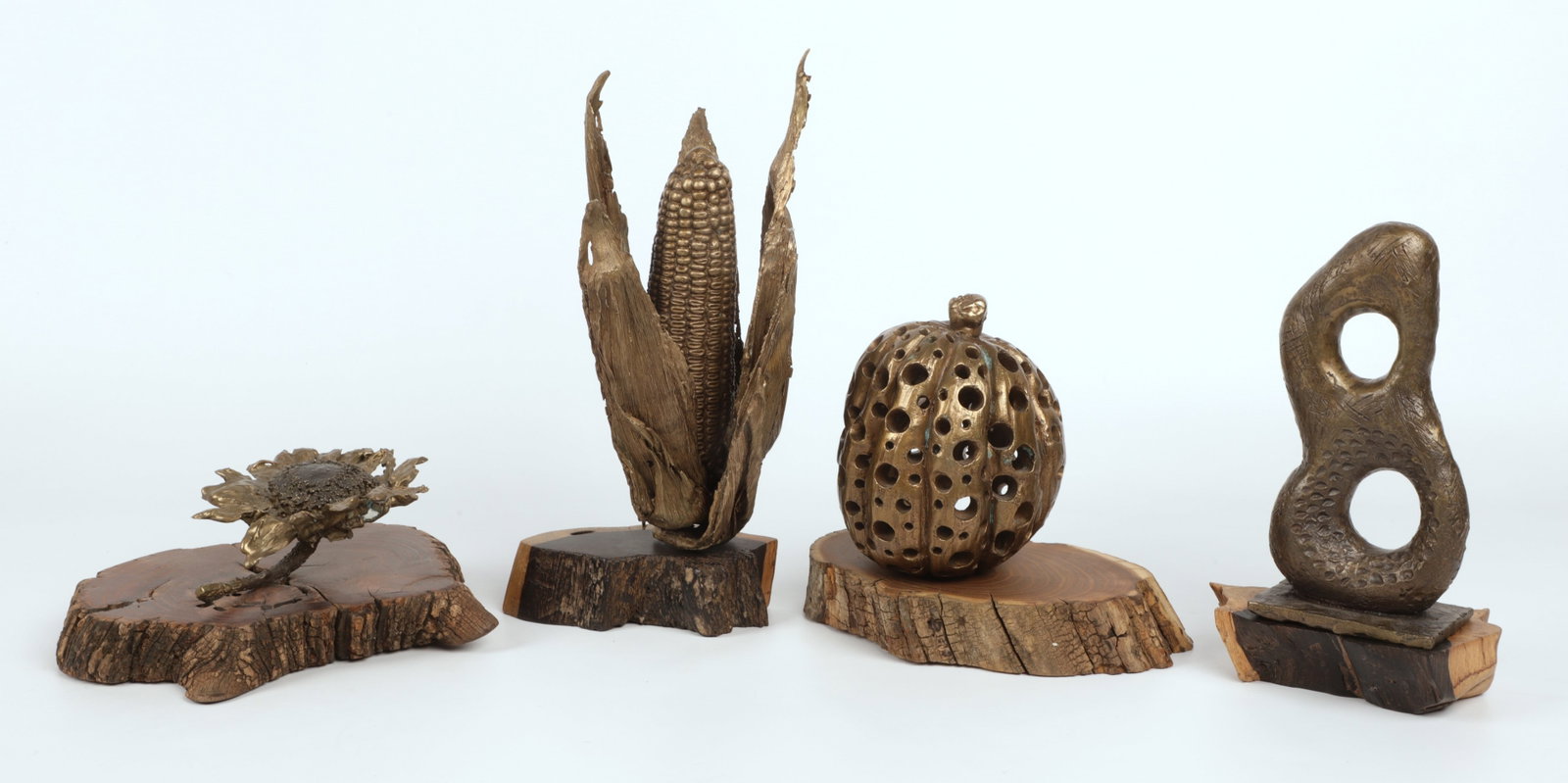 (4) Ron LeMahieu Bronze Sculptures: (4) Ron LeMahieu bronze sculptures to include a cast bronze ear of corn, a pierced gourd, sunflower and abstract figure eight, each with wood plinth