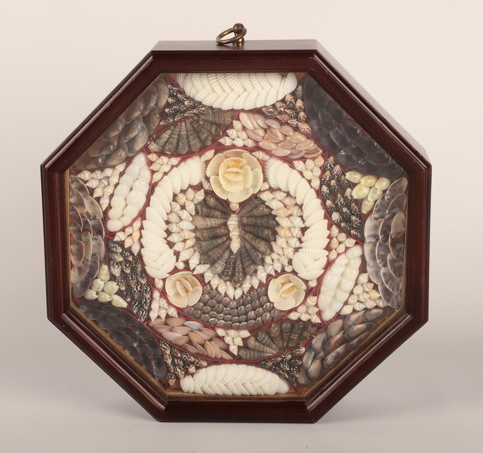 Octagonal Shadowbox Framed Sailors Valentine: Octagonal shadowbox framed Sailor Valentine shell art in shadow box frame (11" dia)