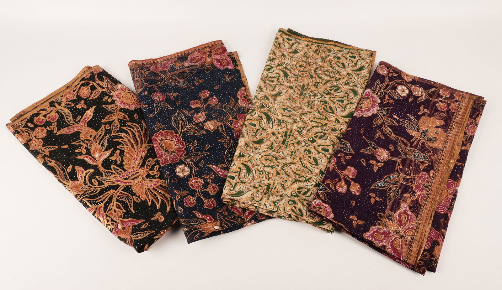 (4) Pcs Batik Fabric: (4) Pcs batik fabric, possibly saree pallu, all with gilt highlights, all measurements are approximate, c/o purple flowers (40" x 86"), green & white with birds (39" x 88"), blue & red with flowers &