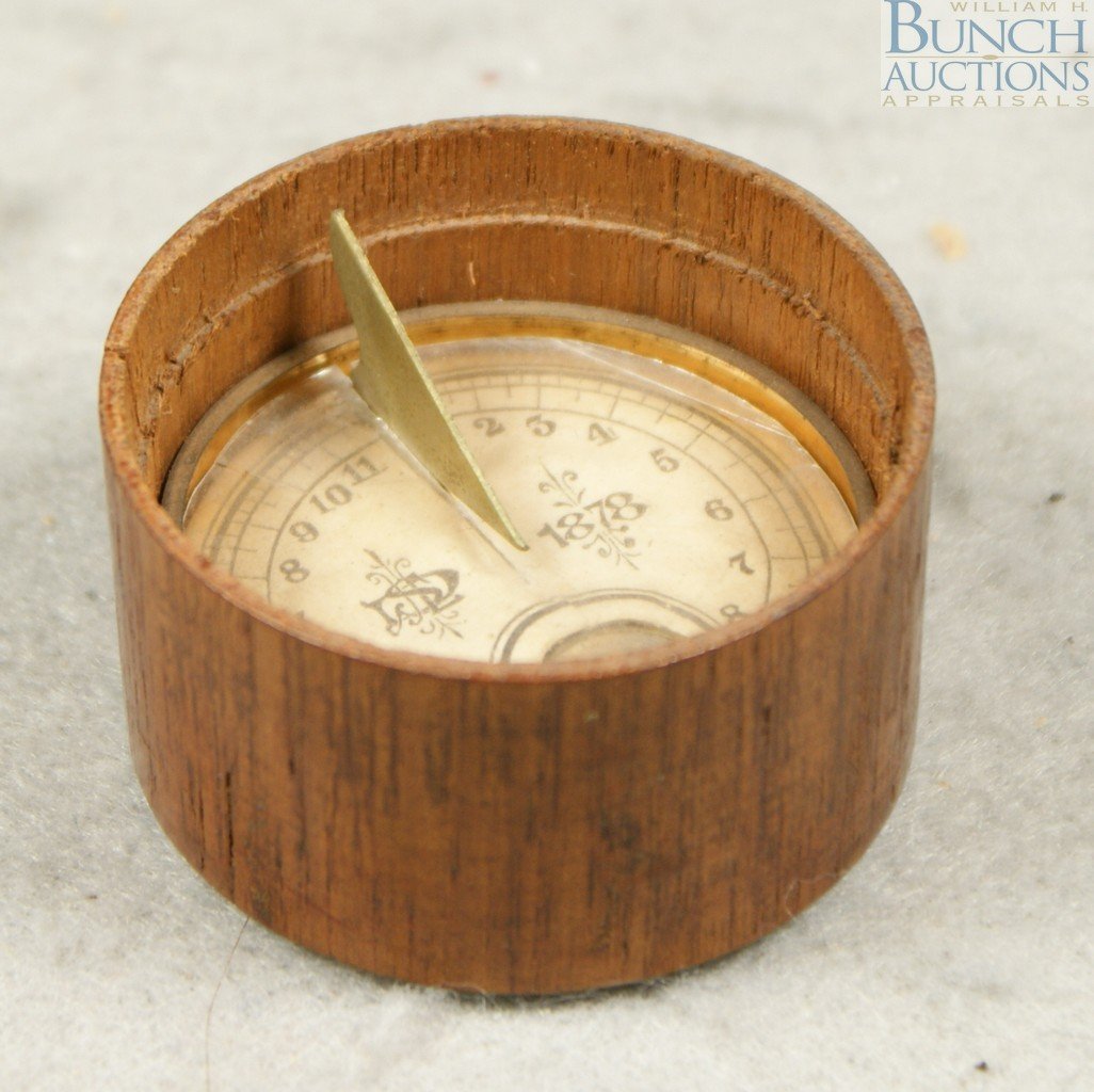 JLD Sullivan's Pocket Sclargraph, wood case with: JLD Sullivan's Pocket Sclargraph, wood case with compass and sundial, 26 School Street, Boston, paper label with makers name and instructions on bottom, 1 7/8" d, 1" h, perhaps lacking its lid