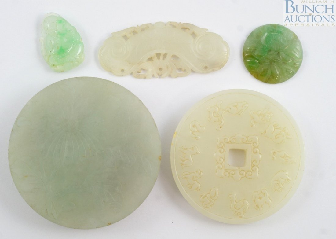 5 pcs Chinese carved jade to include a circular: 5 pcs Chinese carved jade to include a circular buckle, a zodiac plaque, and 3 pierced ornaments. Largest measuring 2 1/4"