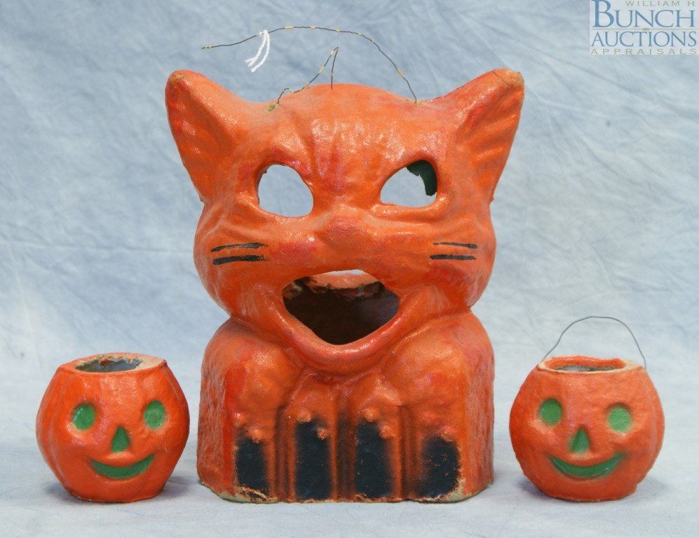 Lot consisting of a pair of Papier-mâché Hallowee: Lot consisting of a pair of Papier-mâché Halloween Pumpkin nut cups, 1950's, 2" high and reproduction orange cat lantern