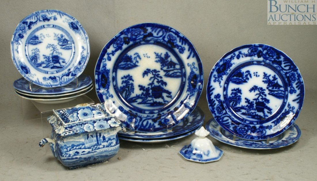(11) Pieces of flow blue china, c/o 9 Improved S: (11) Pieces of flow blue china, c/o 9 Improved Stone China Hong Kong pattern plates, 3 dinner, 10 1/4" dia, 2 luncheon, 4 dessert, a Clews dark blue sugar bowl with damage, and an additional dark blue