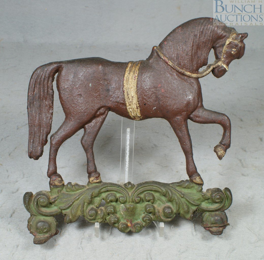 Cast iron prancing horse doorstop, early paint,: Cast iron prancing horse doorstop, early paint, 10 1/2" l, 10 1/4" h