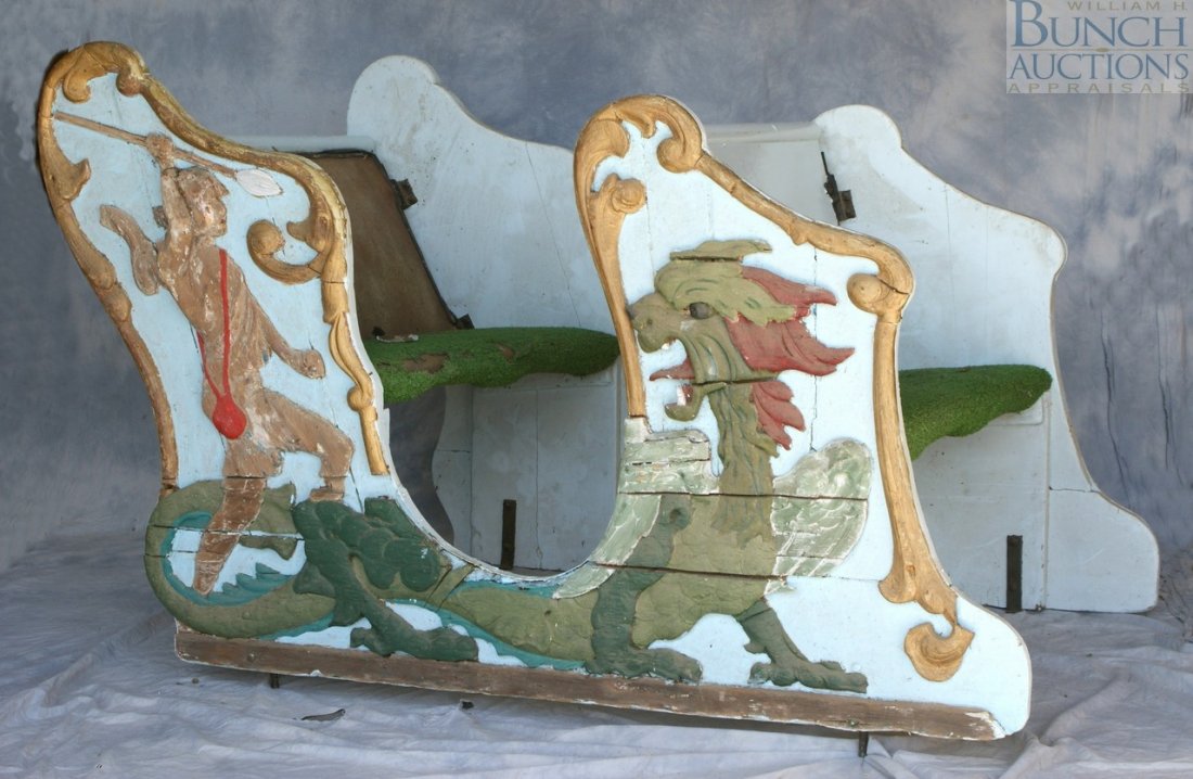 Double seated carousel chariot with applied win: Double seated carousel chariot with applied winged gryphon carving on one side, 68" l, 44" w, 36" h