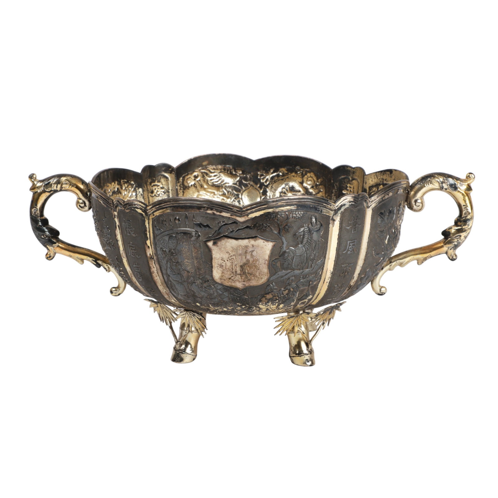 Chinese Export Silver Lobed and Handled Bowl: Chinese export silver lobed and handled bowl, marked at underside 90, retailed by Wing Cheong, Hong Kong, illegible 3-character mark, in all over chased and repousse decoration including dragons, cher