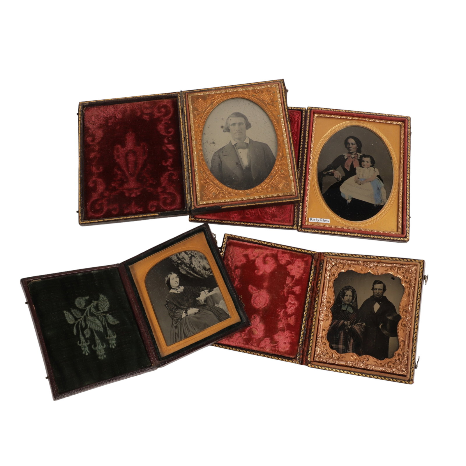 (4) Ambrotype Photographs in Cases: (4) Ambrotype photographs in embossed leather cases, consisting of 1/6 plate of seated woman c 1857 (3-5/8" x 3-1/8"), 1/6 plate ruby glass of man & woman in winter coats c 1857 (3-5/8" x 3-1/8"), 1/4