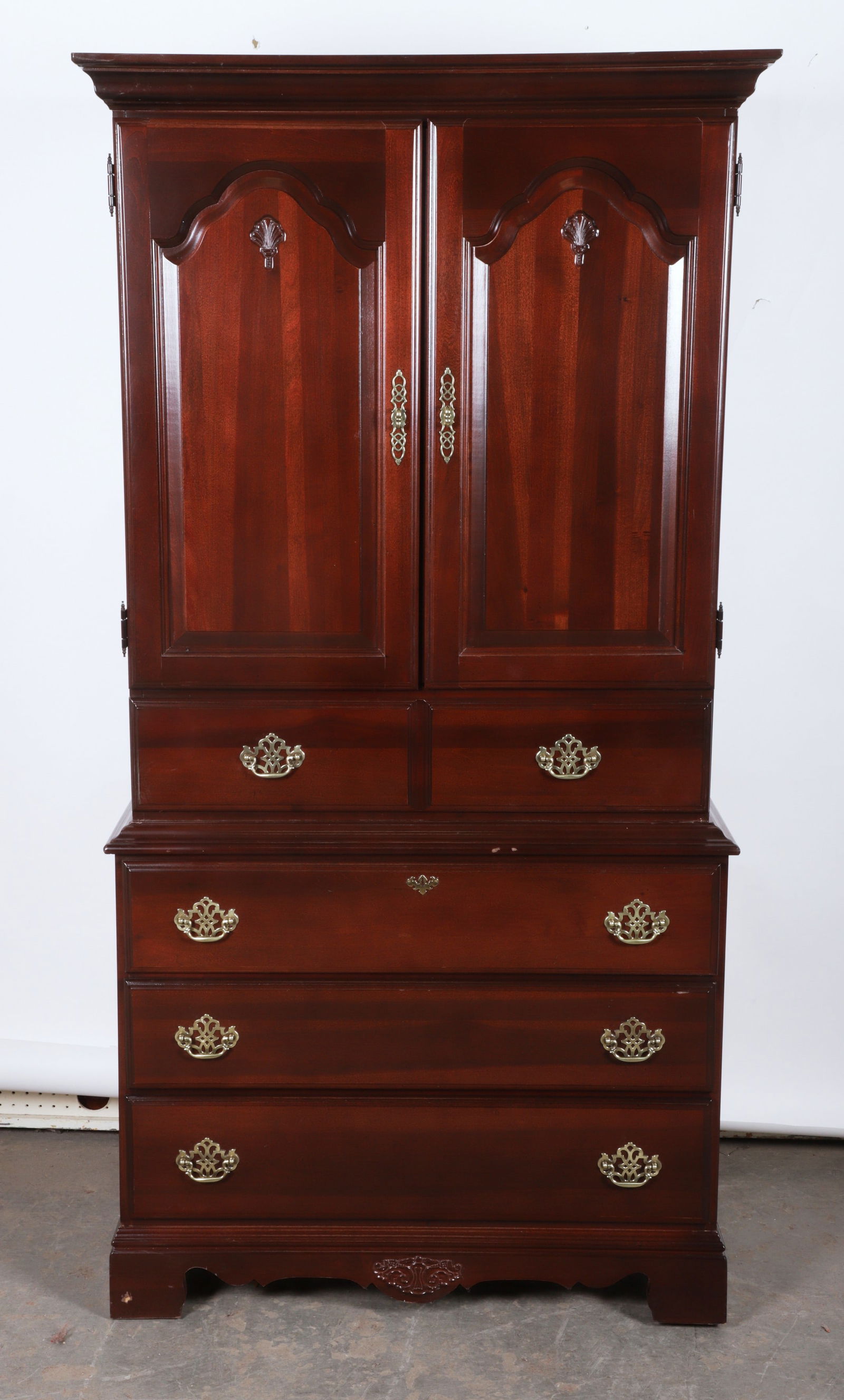 Kincaid mahogany finished Armoire: Kincaid mahogany finished 2 pc Armoire, top - linen press cubbys behind 2 raised panel doors, over drawer, base - 3 drawers on bracket feet, includes attaching screws and shelf to convert top. 75"H x